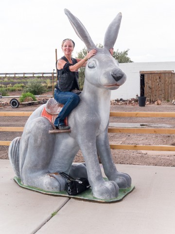 Elaine doing what every tourist does at the Jack Rabbit Trading Post